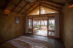 Surya Cafe and Huts Beachfront Hut Bedroom 